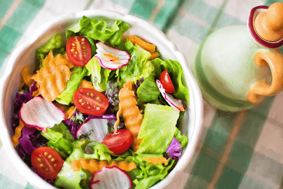 Picture of tropical salad with lettuce, tomatoes, peppers, and avocado